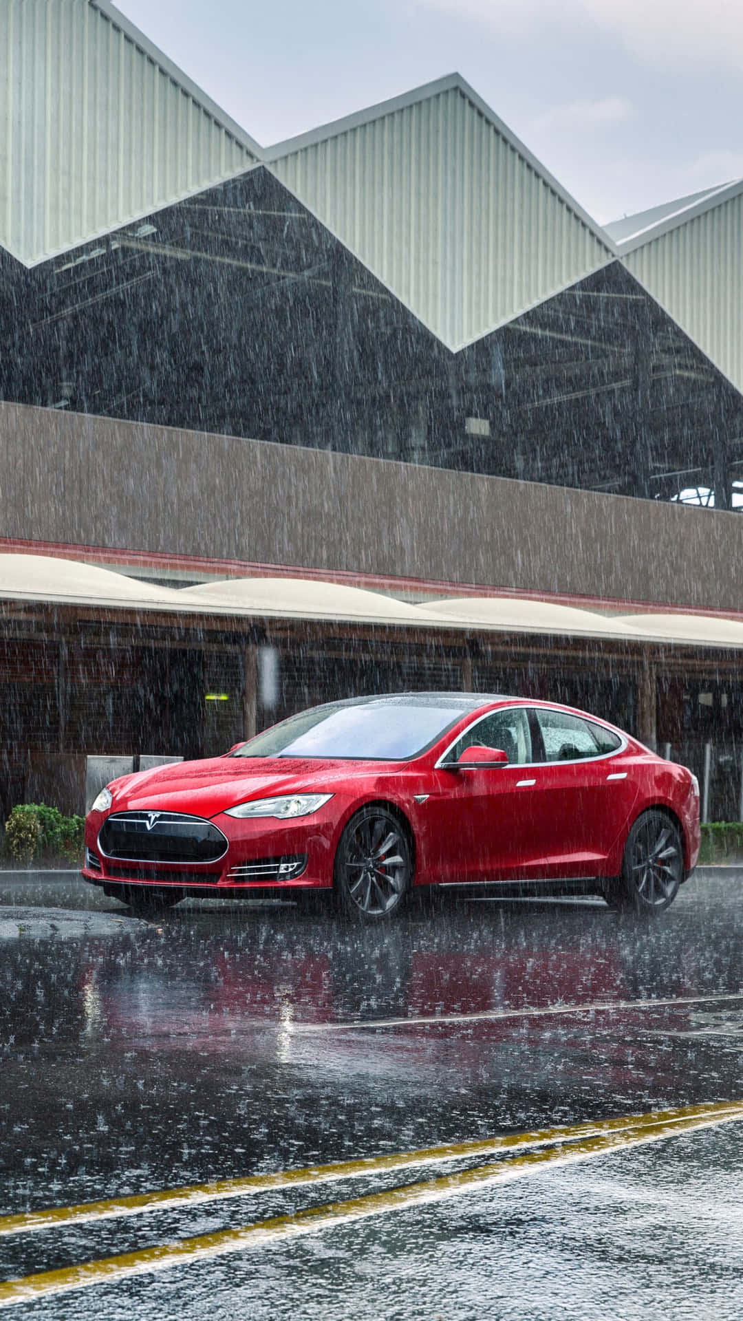Stylish Tesla Model S In The Rain Screen Background
